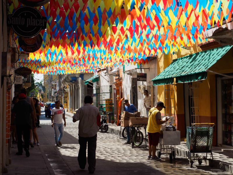 Plastic pennants in the colors of the Colombian flag decorate a street