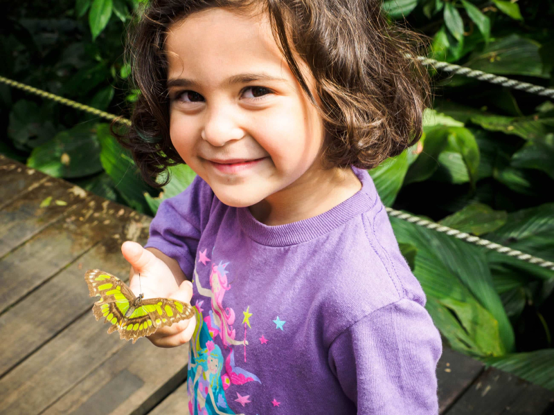 Francesca with a butterfly that landed on her finger
