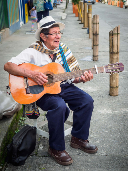 A busker on one of Filandia's main shopping streets
