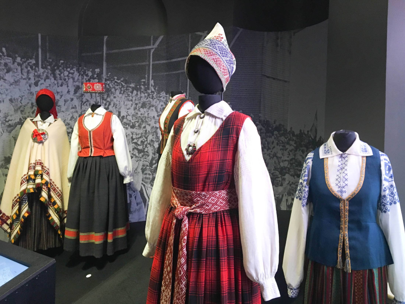 Wool and linen fabrics, embroidery, and woven sashes are important elements of traditional Latvian dress