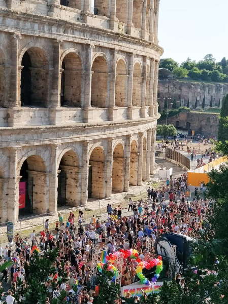 The very modern parade passes the 1st-century AD Colosseum