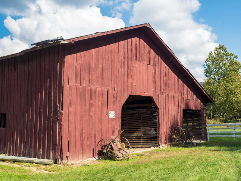 Red barn and old equipment in Valle Crucis