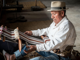 A weaver at the Otavalo Museo Viviente museum of indigenous culture, which is housed in a former textile factory