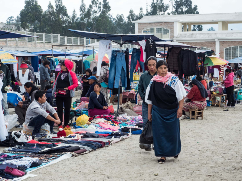 A clothing market next to the livestock area