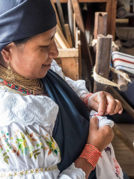 Embroidering the type of blouses worn by many indigenous Otavalo women