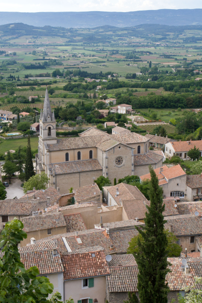 Looking down on rooftops and another church in Bonnieux