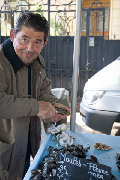 A vendor selling oysters and mussels from the nearby Mediterranean Sea