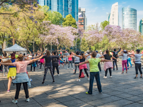 On Sundays, one of the biggest, noisiest streets in the city, Paseo de Reforma, is closed to traffic. It's taken over by cyclists, pedestrians, and exercise classes.