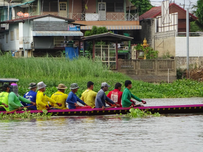 A rowing team practices on the river