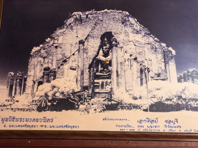 An old photo of the ruined vihara and its Buddha before their restoration