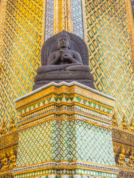 Wat Phra Kaeo's buildings glitter with millions of colored mirrored tiles