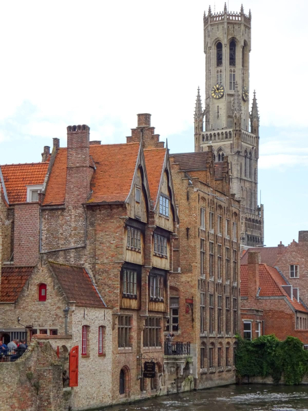 Medieval houses in the shadow of Bruges's 13th-century bell tower