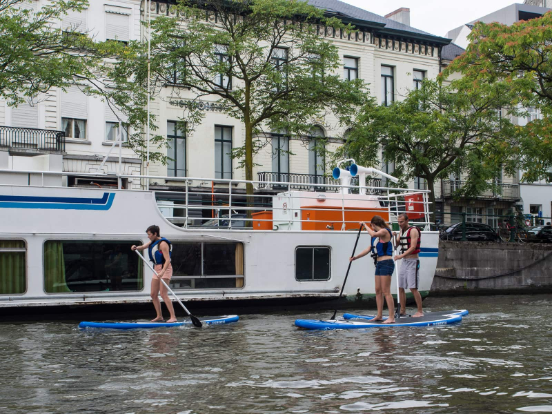 Standup paddleboarding on the Leie River in the center of the city