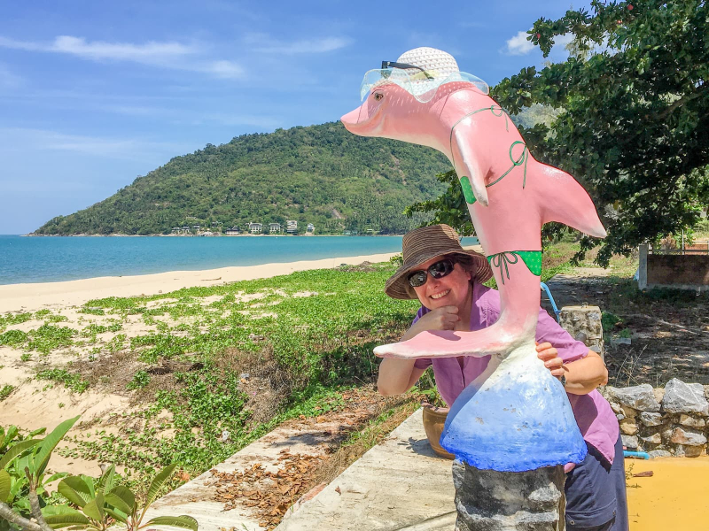 The area around Khanom is famous for its pink-tinged sea dolphins. Chris makes friends with a pink dolphin statue at our guesthouse.