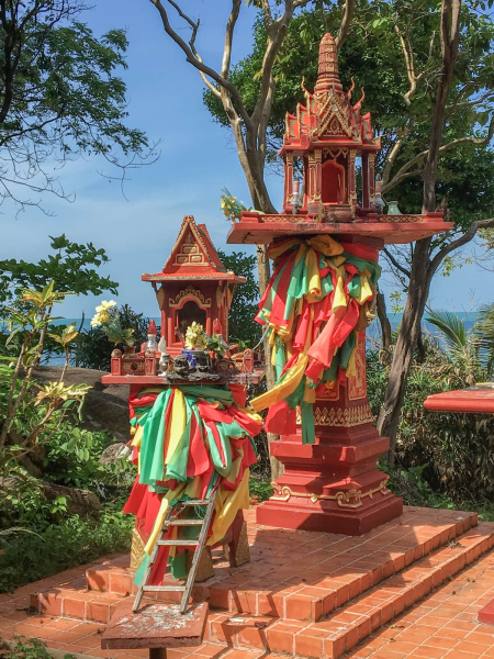 Spirit houses at the Khanom Hill Resort. The lower one is for the local earth spirits (with a ladder so they can climb up), and the higher one is for any spirits passing by in the air.