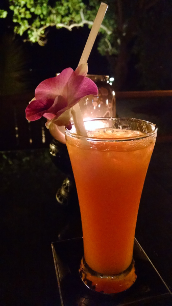 Iced fresh orange juice comes with an orchid for a tropical touch