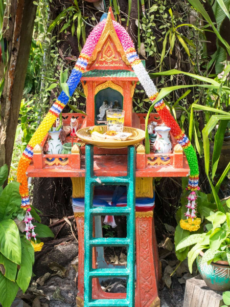 A spirit house in the garden at Longtail Resort