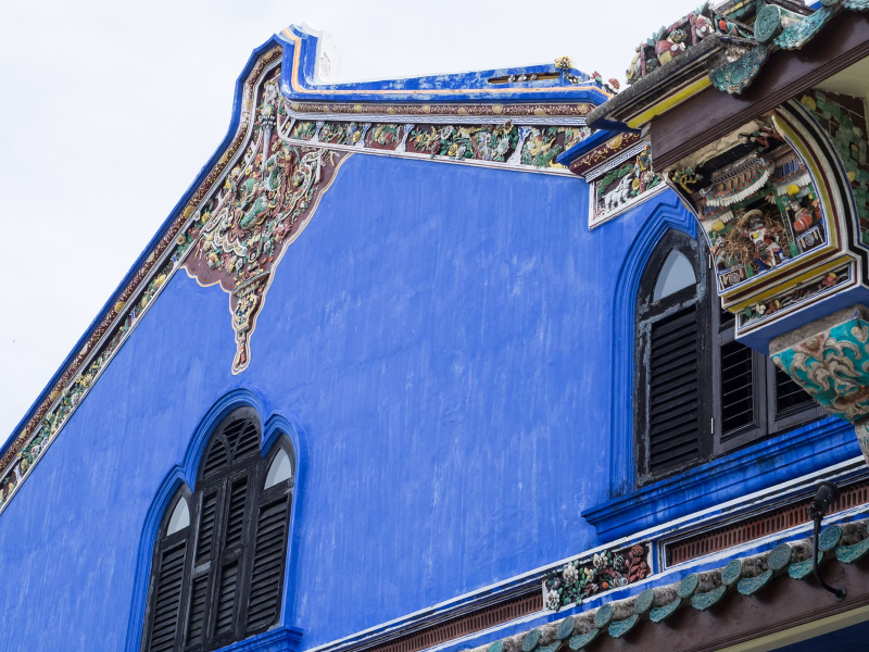 The roof of the Blue Mansion is decorated with colorful mosaics of ceramic tiles