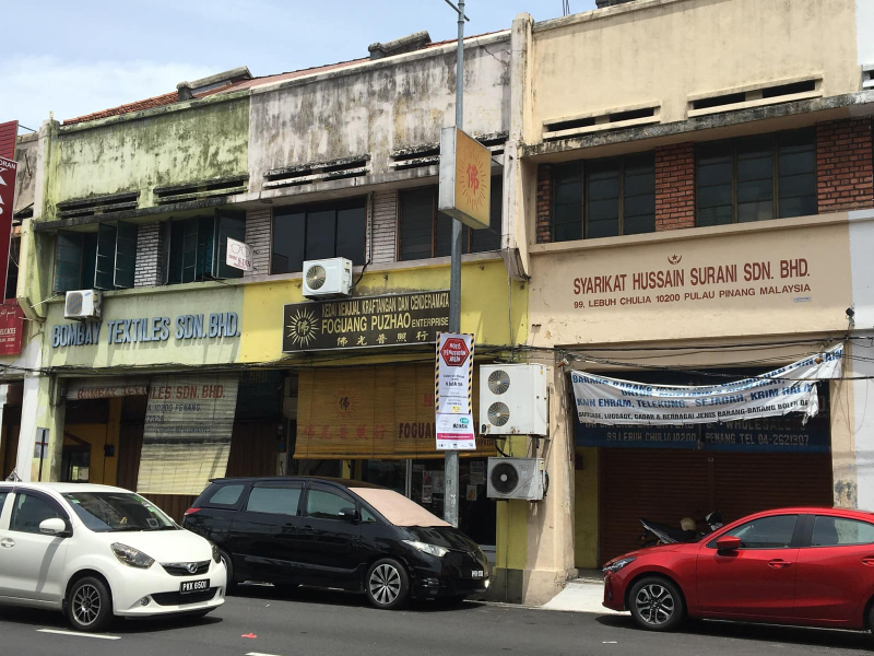 Penang's diversity as seen in a row of three modern shophouses: one Chinese, one Indian, and one Malay