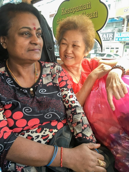 Two strangers who struck up a conversation on a bus (that happens all the time in Penang!)
