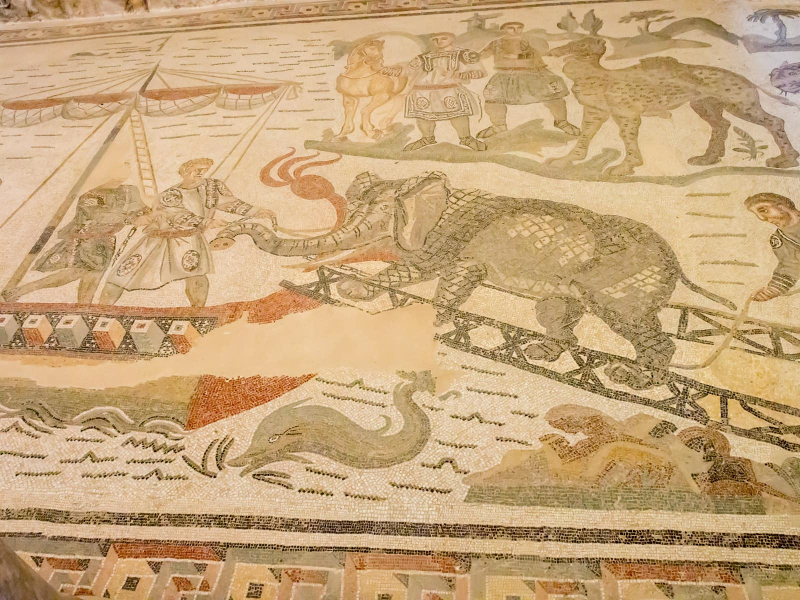 Loading an elephant onto a ship to transport back to Rome