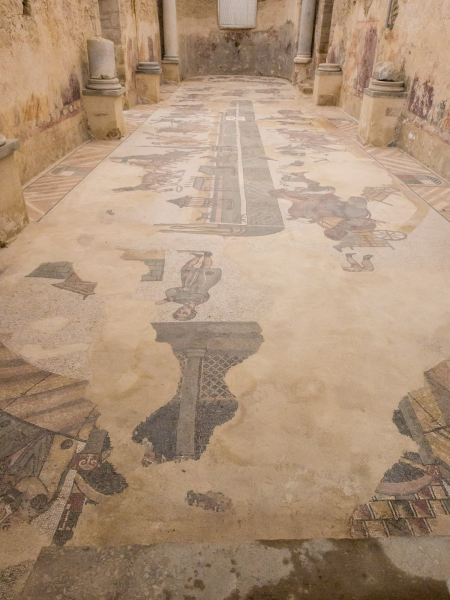 A less well preserved mosaic of a chariot race