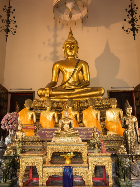 This statue, presented by King Rama I in the late 1700s, shows the Buddha preaching his first sermon to his first followers (five ascetics, all of whom ultimately gained enlightenment)
