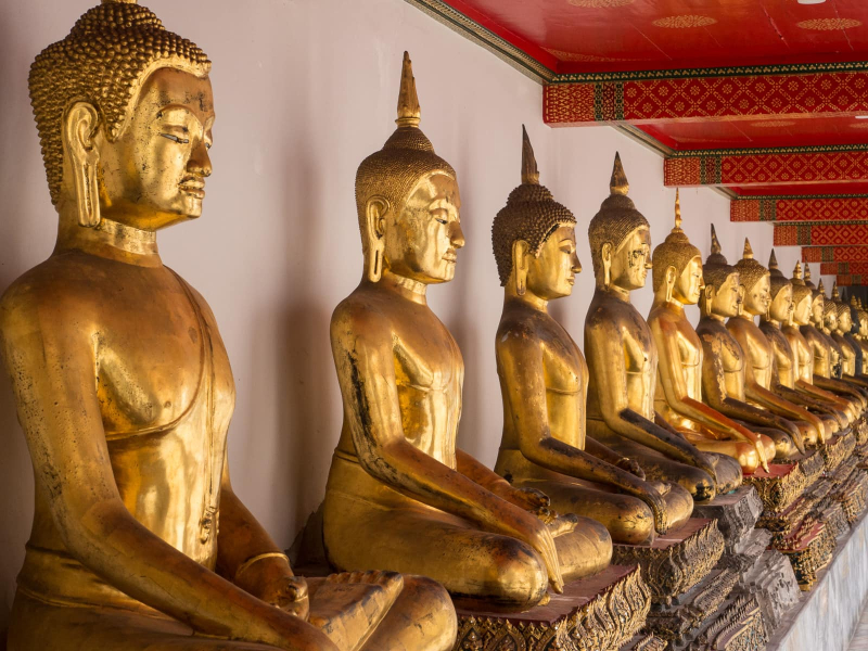 A collection of Buddha statues from northern Thailand donated to Wat Pho (they are made of bronze that has been laquered and gilded)