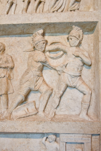 A carving from Pompeii showing gladiators fighting