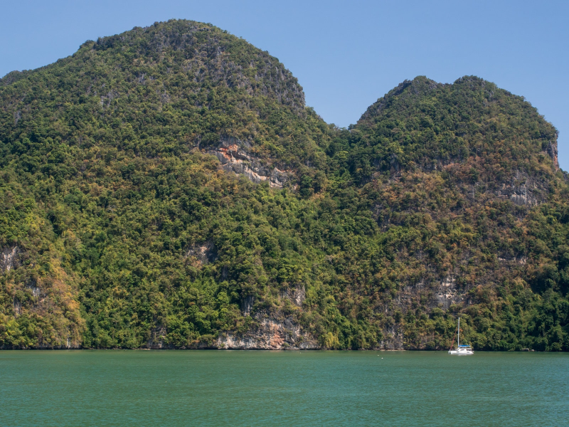 One of the beautiful jungle-covered limestone islands of Phang-Nga Bay