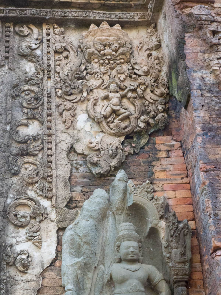 Originally, the brick walls of Preah Ko were covered with carved plaster and brightly painted.