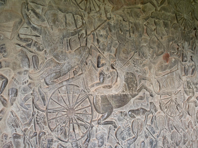 Six-foot-high carvings cover the walls of the galleries (this one showing a chariot at war)