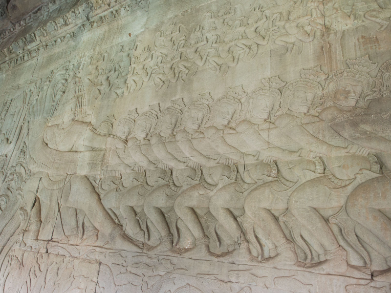 The huge carving showing the churning of the sea of milk; here, demons pull on the head end of the naga