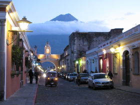 A volcano looms over the Santa Catalina Arch and the cobbled streets of Antigua, the capital of Spanish Central America from 1549 to 1775 