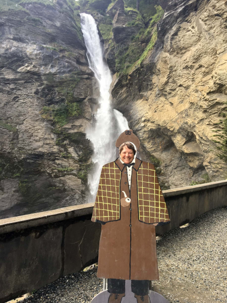 Chris as Sherlock Holmes in front of Reichenbach Falls, where the fictional detective supposedly fell to his death