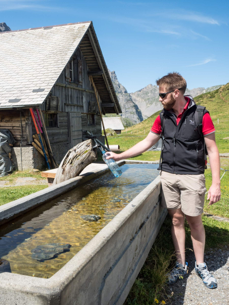 Farms all over Swizerland have fountains where hikers can fill up their bottles (and troughs below for the cows)
