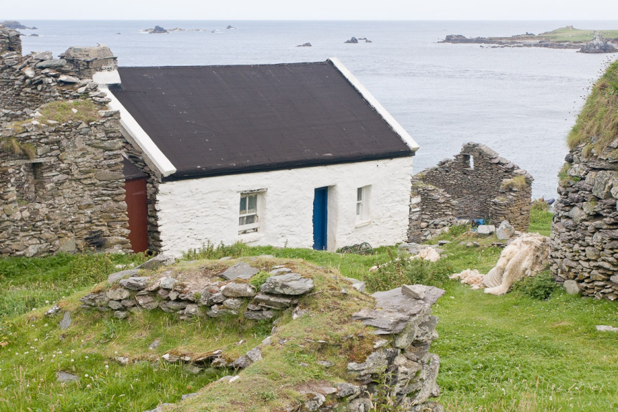 A sheep shearer is living in one of the few restored cottages on the island
