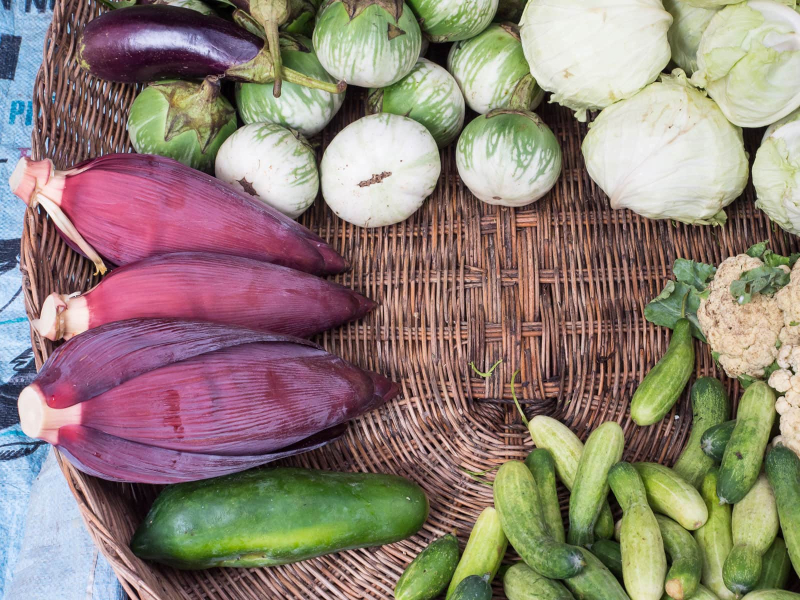 From left: banana flowers, eggplants, cabbage, cauliflower, and cucumbers, all of which are used in salads or soups