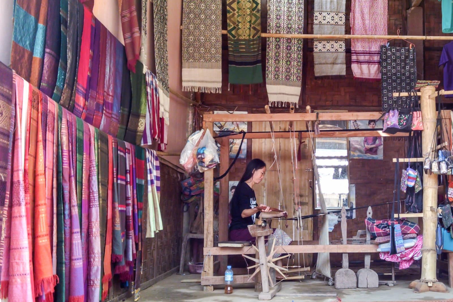 A village weaver at work in her shop