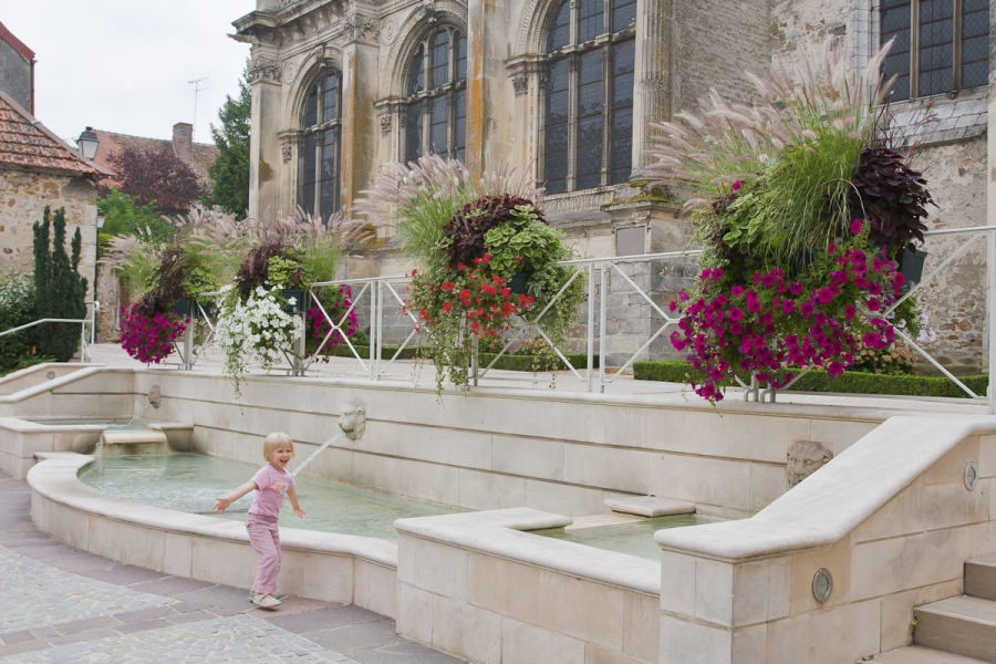 Our hosts' daughter, Flora, playing in a fountain in Nogent