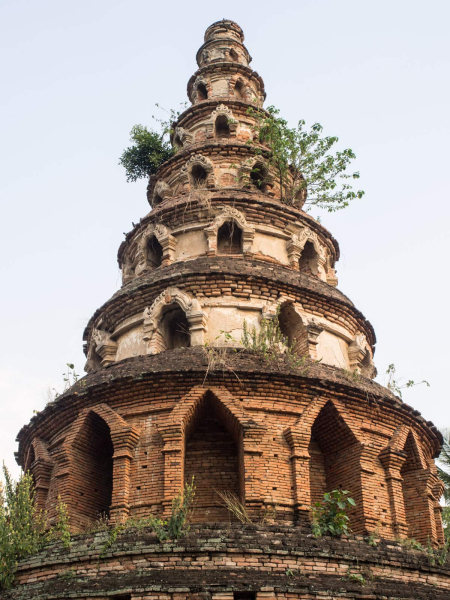 An old brick tower behind the talkative monk's temple