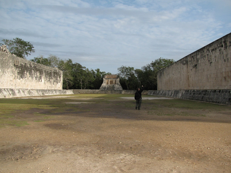 Chris walks through one of the many ball courts at Chichen Itza 