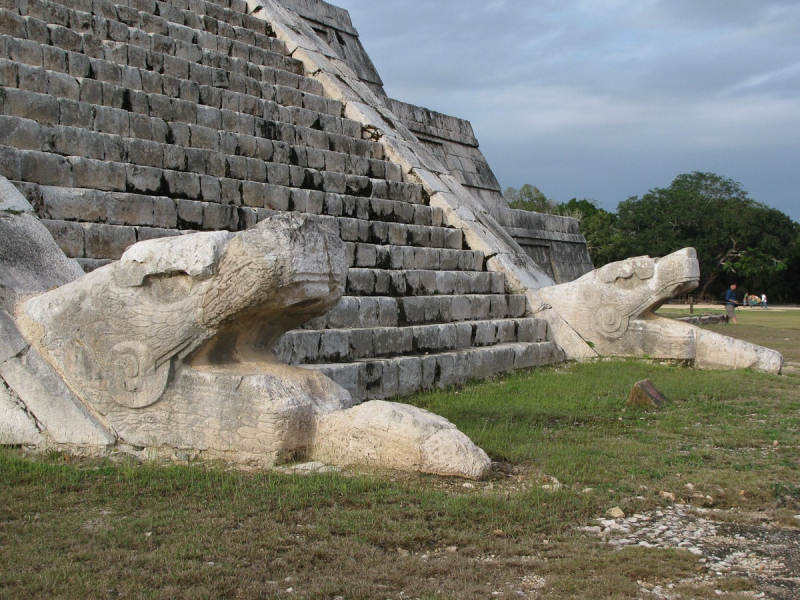 Serpent heads at the base of a staircase on El Castillo