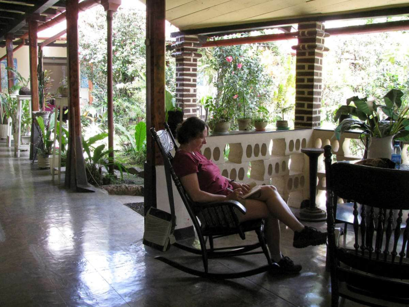 Relaxing outside our room at the Posada Monja Blanca guesthouse, a traditional house with a shaded veranda around a flower-filled courtyard