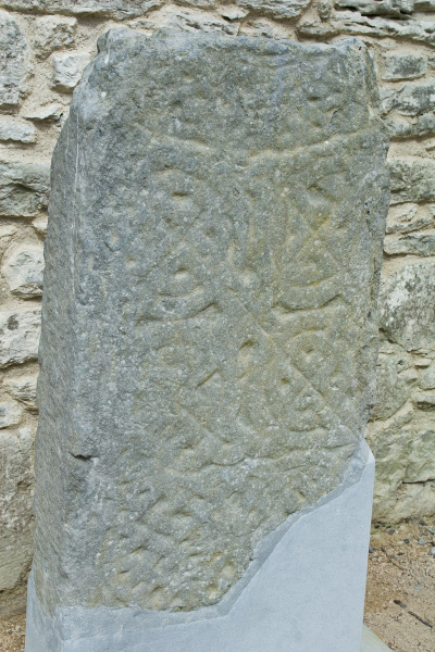 A fragment of a high cross with a Celtic knotwork pattern