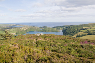 County Cork in Ireland's far southwestern corner features rolling hills and beautiful coastlines. This view is from Knockomagh Hill, near Skibbereen, looking over Lough Hyne to the ocean.