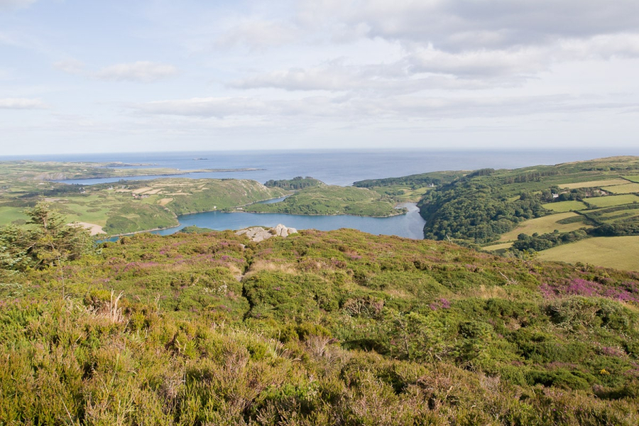 County Cork in Ireland's far southwestern corner features rolling hills and beautiful coastlines. This view is from Knockomagh Hill, near Skibbereen, looking over Lough Hyne to the ocean.
