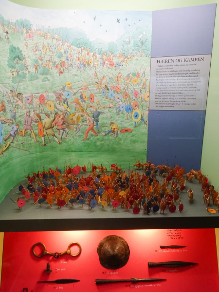 A depiction in the Haderslev archaeology museum of a Viking-era battle in the area, plus artifacts from the battle 