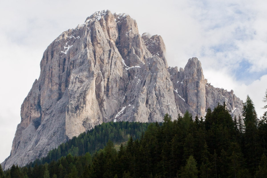 In northeastern Italy, near Austria, the Dolomite mountains (ancient coral reefs) tower over spruce-covered hillsides and German-speaking Alpine villages. This peak is Sassolungo, which we could see out our window in the village of Santa Cristina.