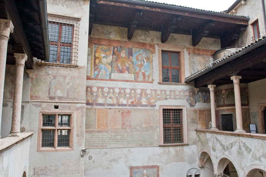 Frescoes in the castle's courtyard depict the prince-bishops who ruled Trento